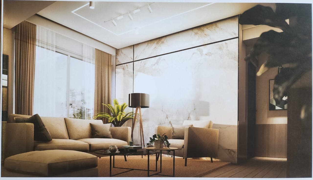 Lounge seating in an A.S.G. residence, facing a marble wall beside a full-height window