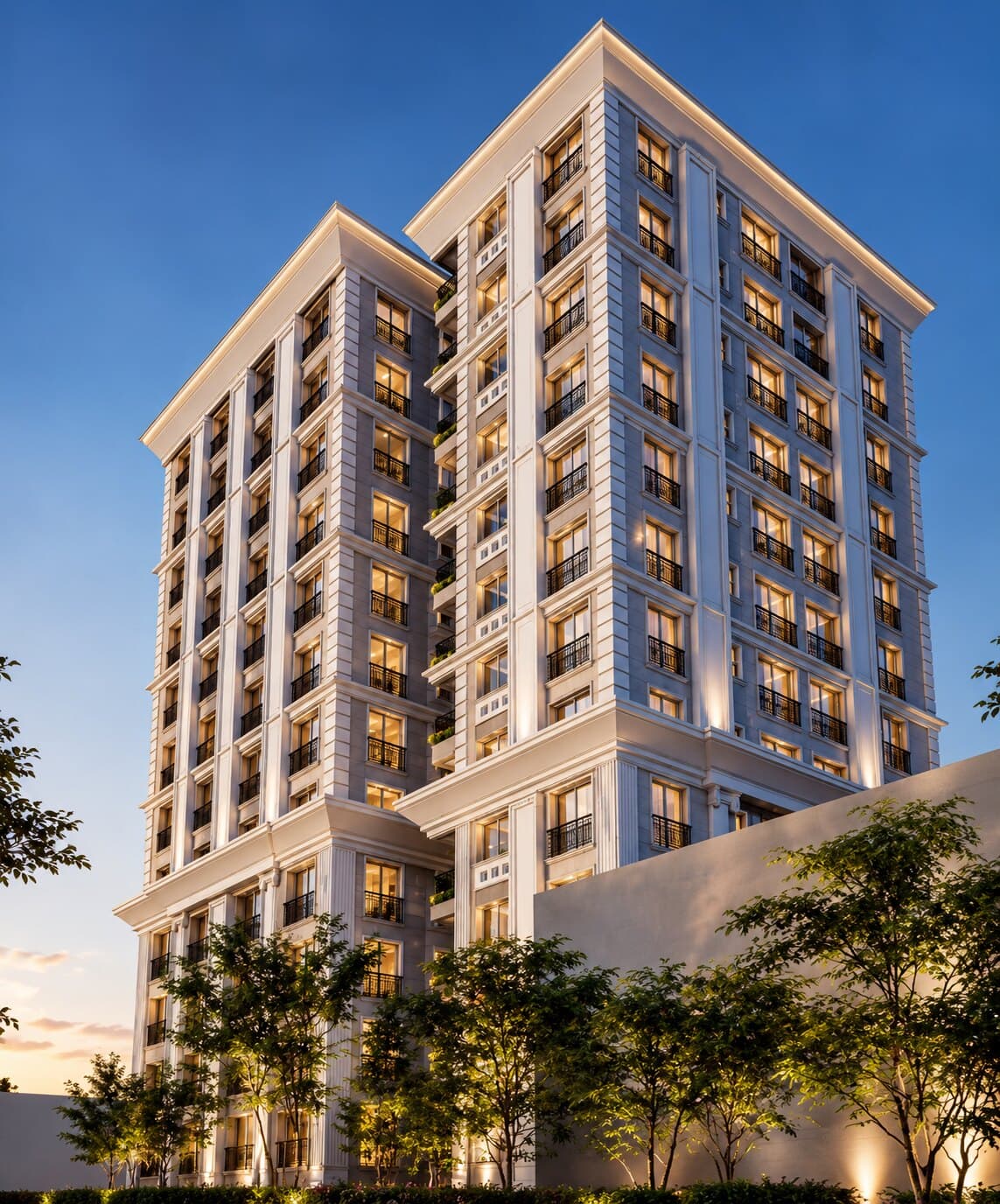 Exterior of an A.S.G. residential tower at dusk, its balconies and windows lit against a deep blue sky